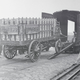 Budweiser wagons, once drawn by six horses, were a familiar sight in pre-Prohibition days. In this 1933 photograph, one is unloaded in New York after being sent from St. Louis, Missouri, by the Anheuser-Busch Brewery. The wagon was taken on a tour of the Eastern states to remind residents that beer would soon arrive.